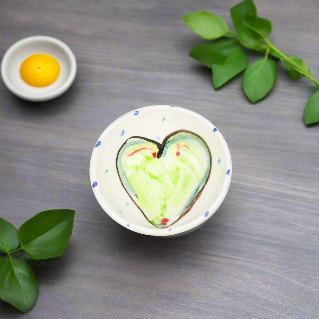 Small pottery bowls suitable for soups and desserts with hand painted green hearts