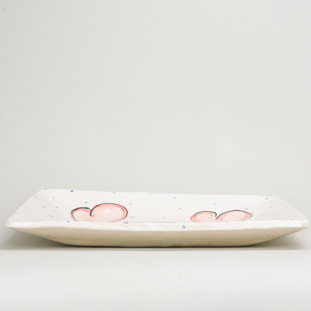 Side view of Extra Large Square Platter with Hand Painted Pink Hearts - perfect for serving food to large family gatherings