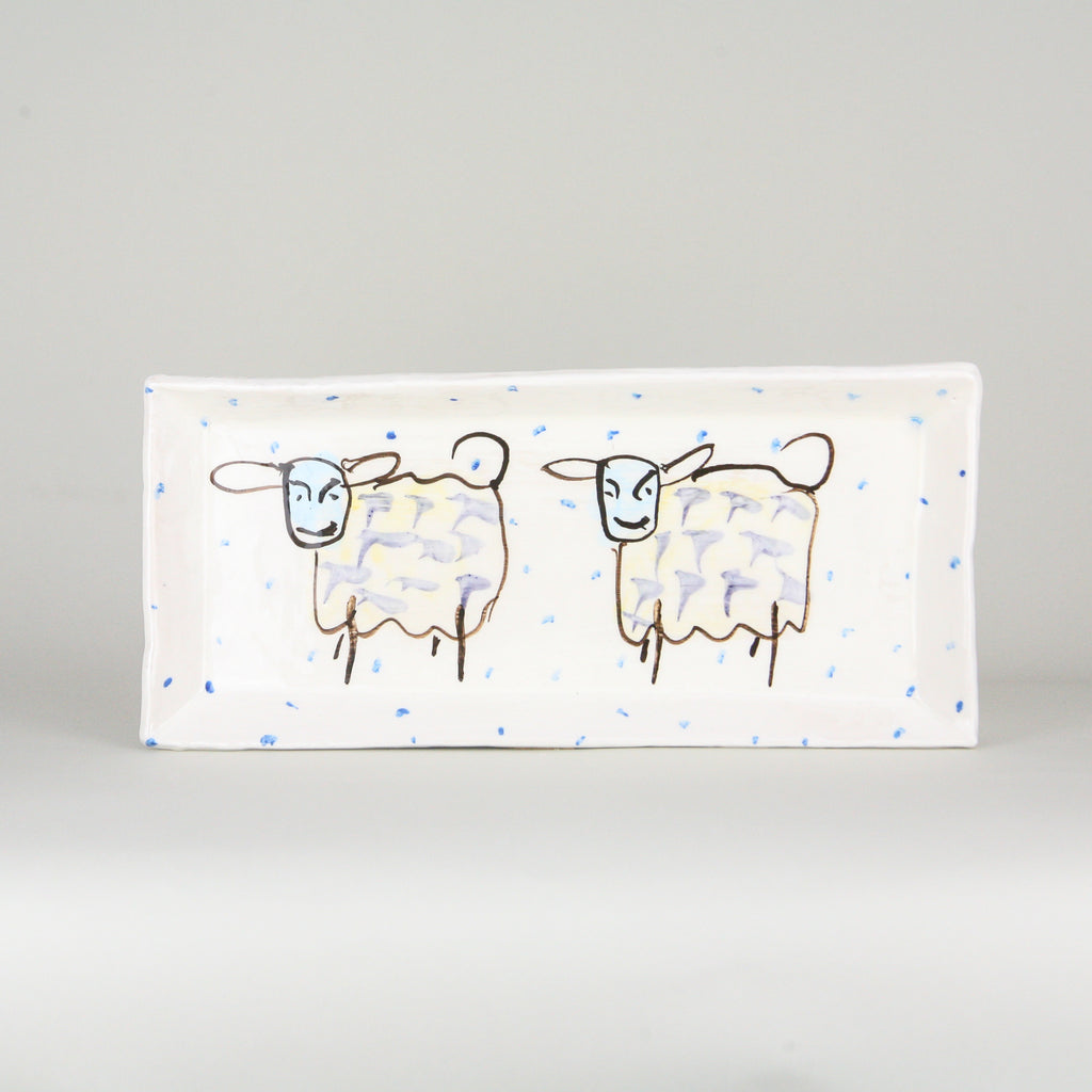 Small Rectangular Ceramic Serving Plate with two hand painted Sheep and periodic blue dots on a luxurious white background