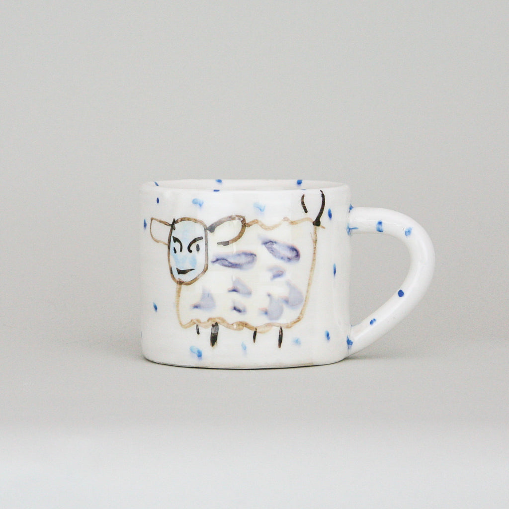 One Large Mug with hand painted Witty Sheep Design with periodic blue dots on a luxurious white background