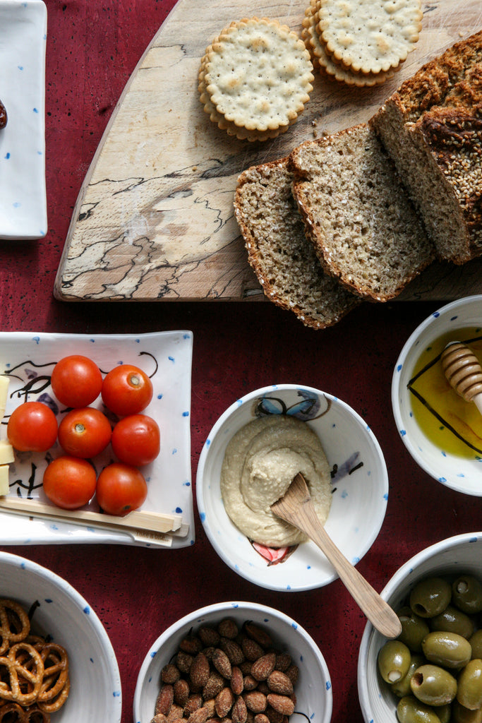 Selection of small serving plates and small bowls and ramekins, that compliment each other and are great for serving party food.