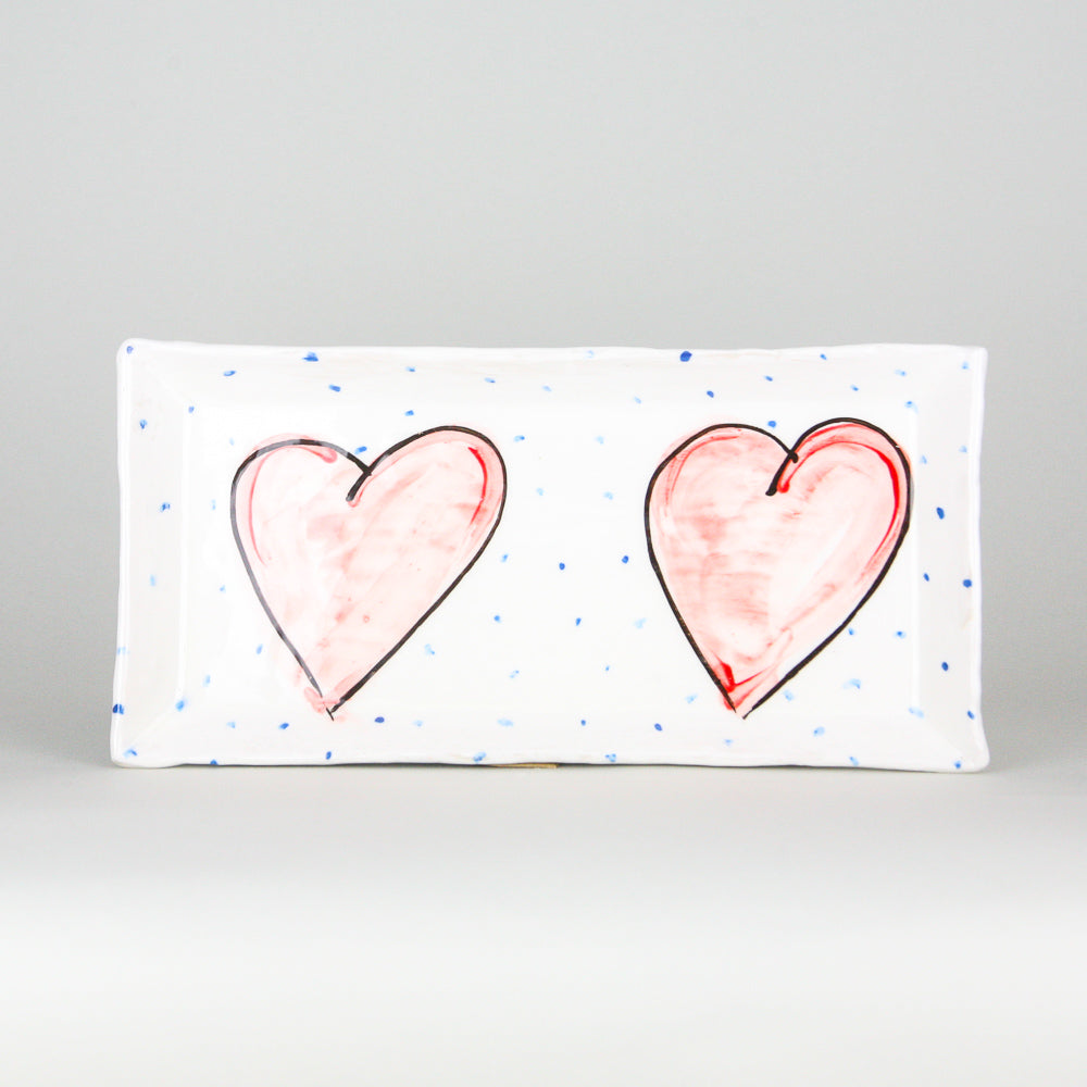 Unique Irish Ceramic Rectangular Serving Plate with two hand painted Pink Love Heart Designs with peridoc blue dots on a luxurious white background