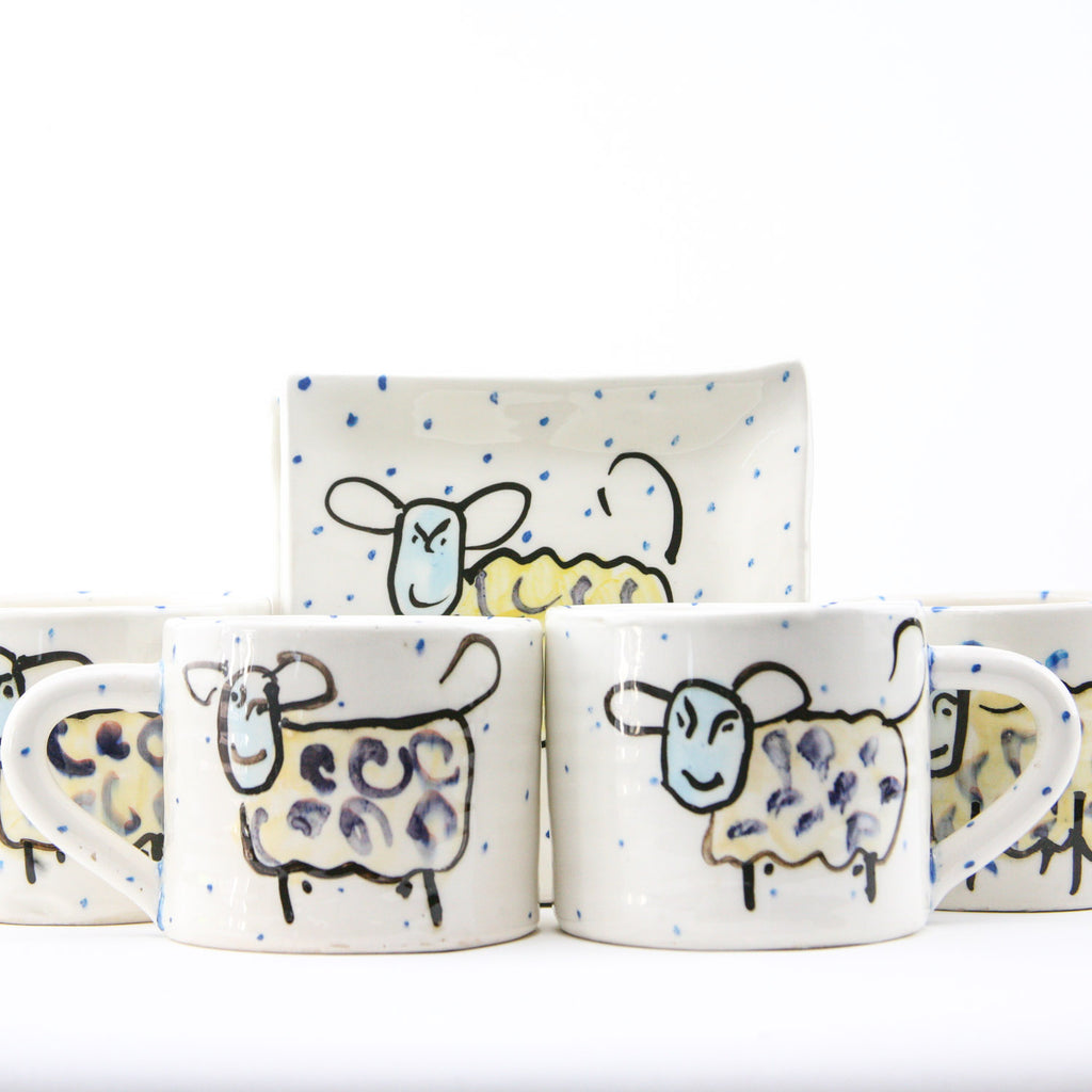 Unique Irish gifts - Irish Tea Sets consisting of four mugs and four saucers all handmade and hand painted with humorous irish sheep with periodic blue dots on a beautiful white glaze. Perfect House Warming Gifts