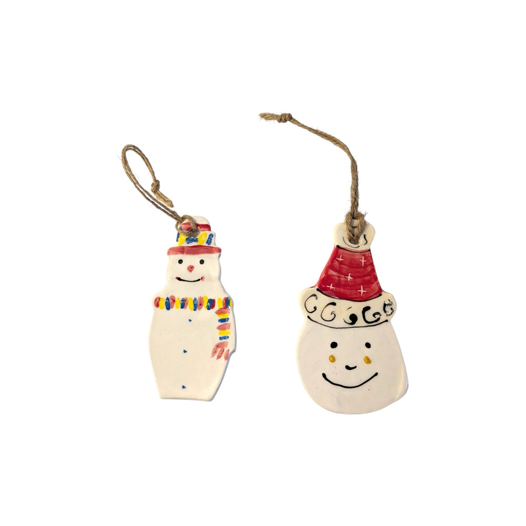 Two Christmas Decorations on a white background in Snowman Christmas Baubles and Santa Christmas Bauble