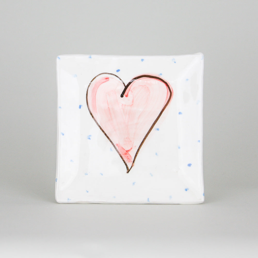 Small square white earthenware plate with a red heart outlined in black hand-painted. Handmade in Ireland.