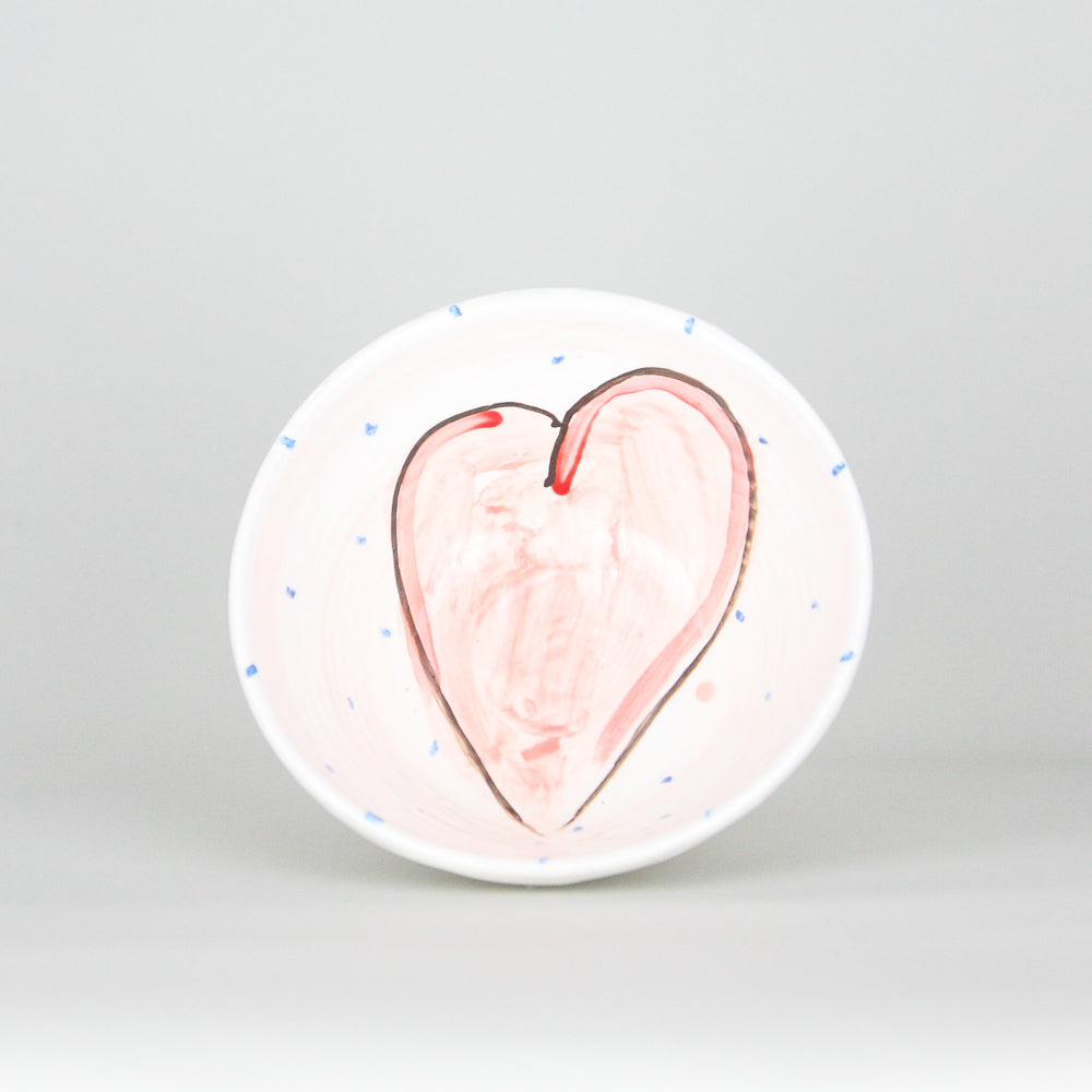 Hand-painted red heart with black outline with blue dots peppering the white Irish ceramic pottery. Handmade in Ireland.