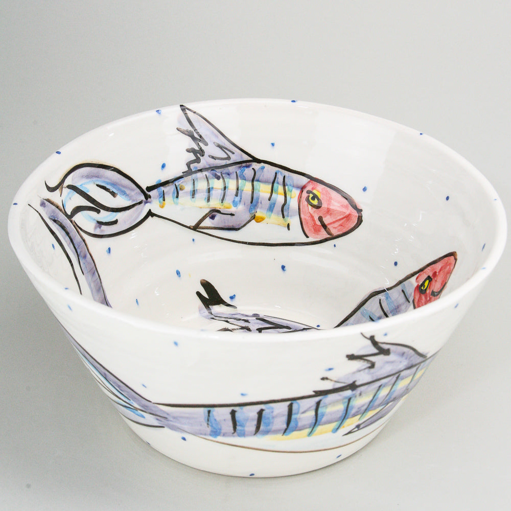 Large white ceramic bowl hand-painted with mackerel fish on this Irish pottery. Little blue dots pepper the high-gloss finish. Handmade in Ireland.