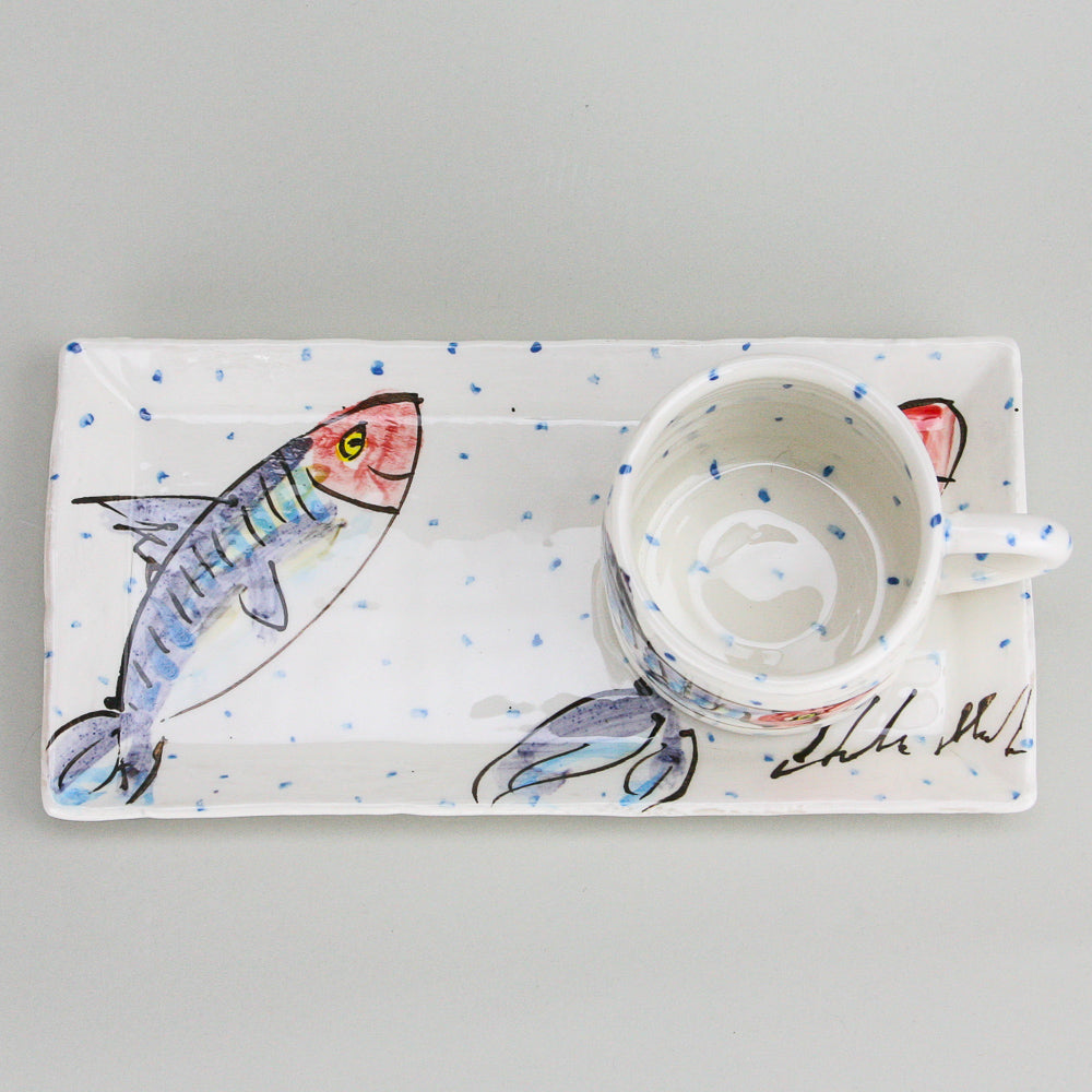 Mackerel fish rectangular platter and mug set. The mug sits on the right side of the platter and handle facing right. Blue dots pepper the handmade Irish pottery. 