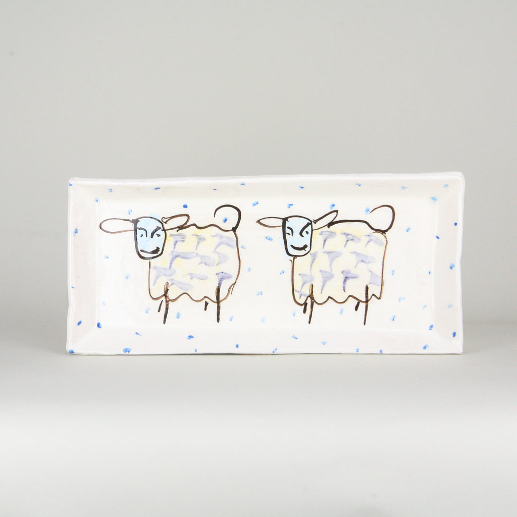 Rectangular platter. White pottery peppered with blue dots and four hand-painted witty sheep. Signed by the artist. Handmade in Ireland.